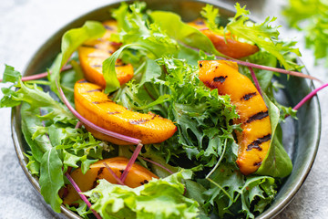 grilled peach salad lettuce leaves mix nectarine ingredient natural product serving size top view copy space for text keto or paleo diet raw