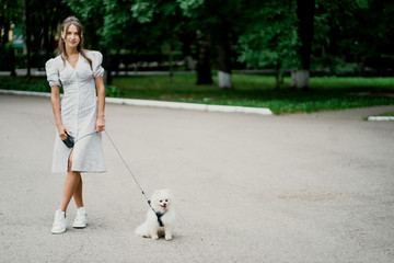 woman walking with dog