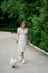 little girl walking with dog