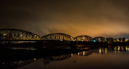 Bridge over Wisla river in Bydgoszcz city during night.