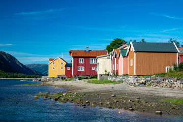 Old wooden houses by the river Vefsna in Nordland county