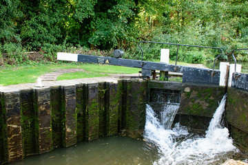 River gateway, sluice. Summer time.