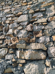 The brickwork wall is made of large granite blocks.