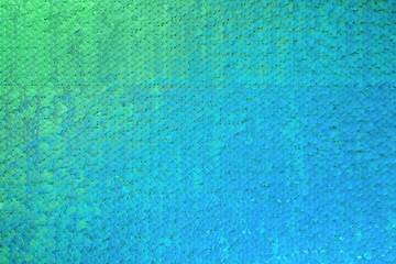 Colorful abstract sequins background in neon light. Bright holiday backdrop for your design. Holiday banner design. Abstract wallpaper.