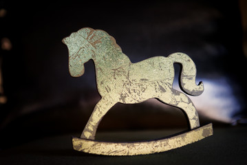 Christmas composition with wooden toy gold horse
