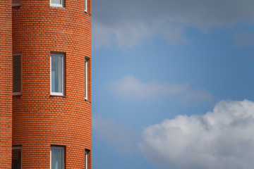 Close-up of architectural details and window of an old building against the blue sky, background or concept