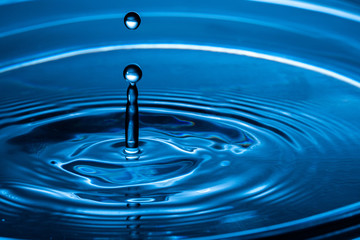 Water drop splash. Blue water