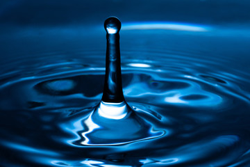 Water drop splash. Blue water