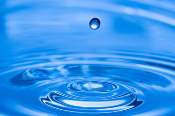 Water drop splash. Blue water