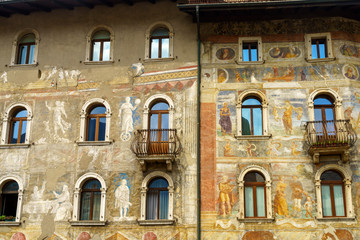 Trento, Italy: painted facade of historic buildings in the cathedral square