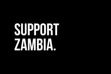 Support Zambia. White strong text on black background meaning the need to help the people in Zambia.