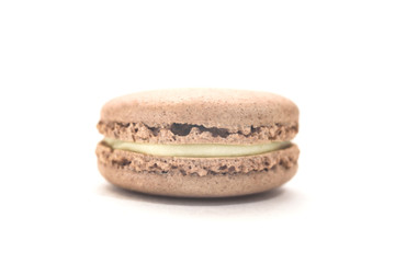 One tasty french chocolate macaron isolated on the white background. Colorful macarons. Front view.