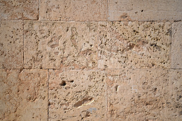 Stone wall in old town in Spain
