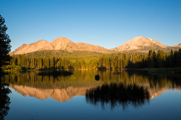 Sunset hitting Lassen Peak as seen from Manzanita Lake in Lassen Volcanic National Park (California).
