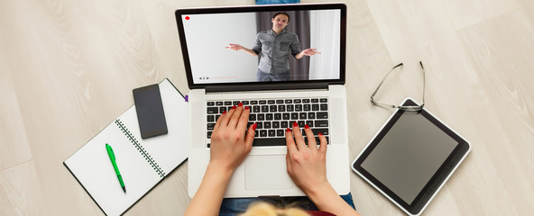 Close-up Of Businesswoman Video Conferencing With Colleague On Laptop
