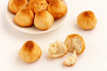 Crunchy Coconut cookies on white wooden background.