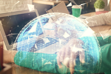 Double exposure of man and woman working together and financial theme hologram. international business concept. Computer background.