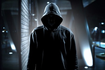 Thief in black clothes on room background - obrazy, fototapety, plakaty