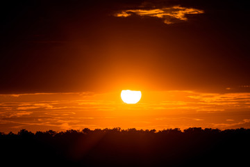 dark sunset with cloudy sky