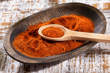Paprika powder in a wooden bowl - Text Space