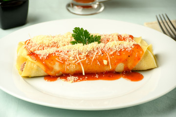 delicious meat pancake with red sauce and parmesan cheese