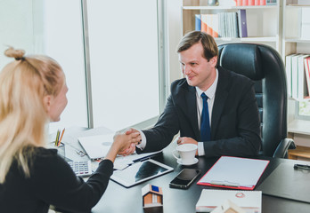 Business people shake hands with young customers when they can successfully negotiate business.