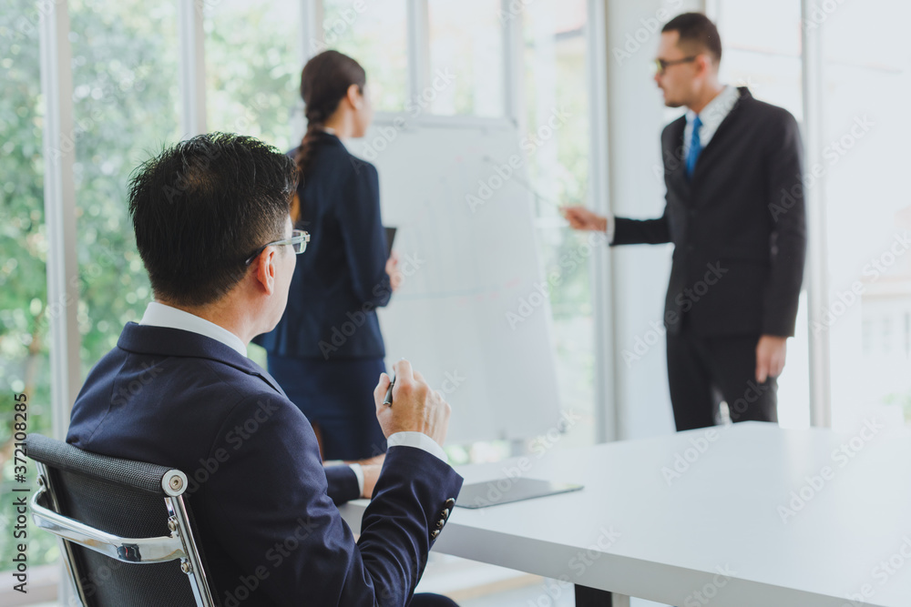 Poster asian company meetings for presentation as statistical graphs. boss listened to the speaker's presen