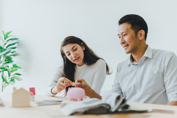 Asian couples, husbands and wives come together to design a house. To live together as a family in...