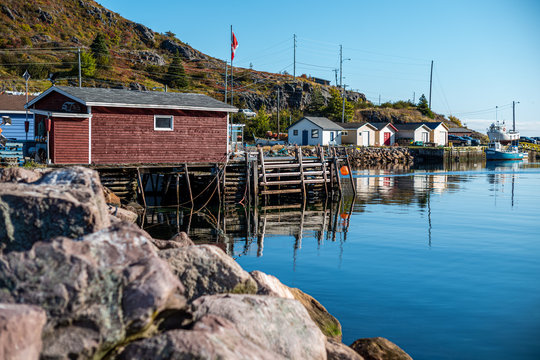 Small boat in tranquil harbour Newfoundland
