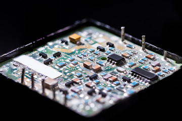 Electronics Industry and Manufacturing. Macro Shoot of Dusty Printed Circuit Board in Package with...