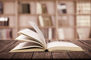 Open book on the wooden desk. Education concept