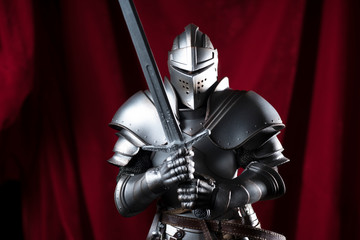 knight with sword and red velvet background