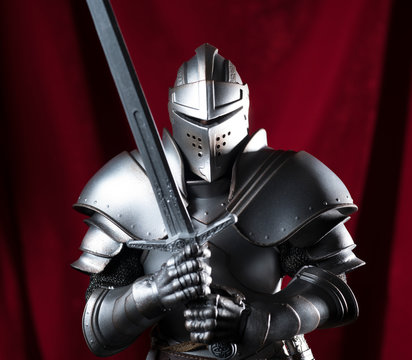 knight with sword and red velvet background