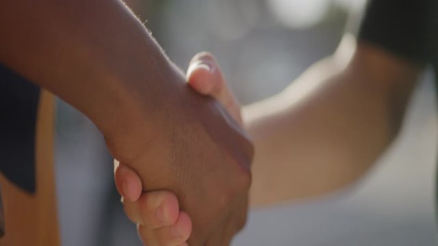 Handshake Close Up in Slow Motion, African American and Caucasian Men