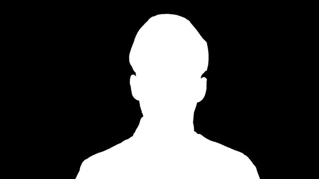 Man soldier saluting, white silhouette on black background.