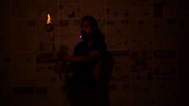 Indian Monk with mashal(Fire stick torch)