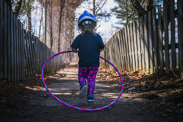 Girl on path with hula hoop