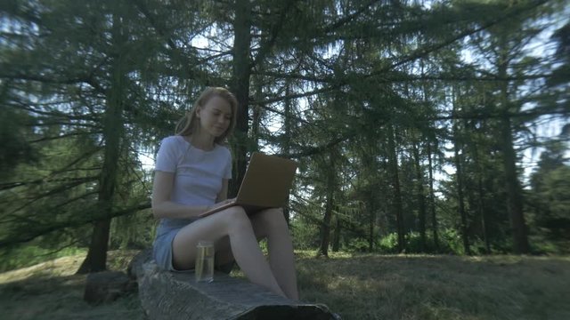 A Cute Girl Freelancer Have Copywriting Practice In The Park At Noon.
