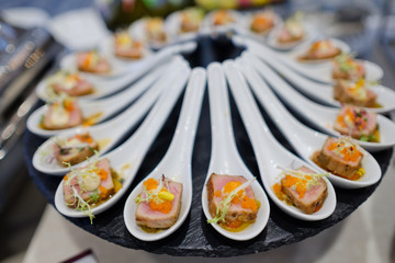 buffet food, catering food party at restaurant, mini canapes, snacks and appetizers
