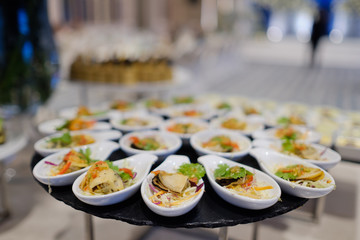 buffet food, catering food party at restaurant, mini canapes, snacks and appetizers
