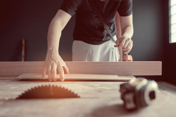 cutting wood for building,  carpenter, worker
