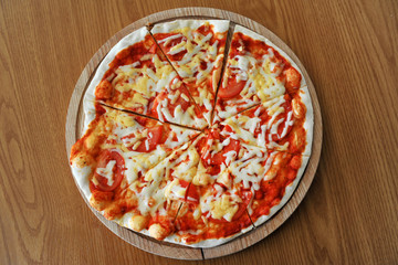 Pizza with tomatoes and mozzarella cheese.