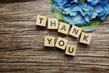 Thank You alphabet letters on wooden background