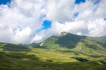 Fototapeta premium Blooming meadows in the summer landscapes of the caucasus mountains in Russia