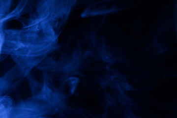 Blue steam on a black background.