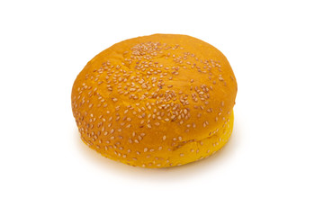 Yellow burger bread isolated on white.