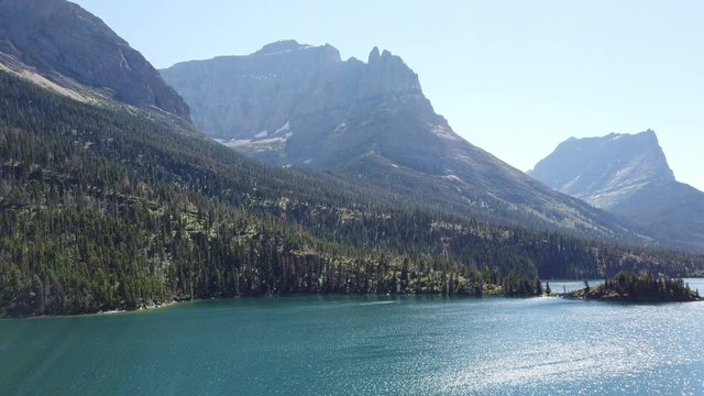 wonderful lake surrounded by mountains at glacier national park, visit montana, travel montana