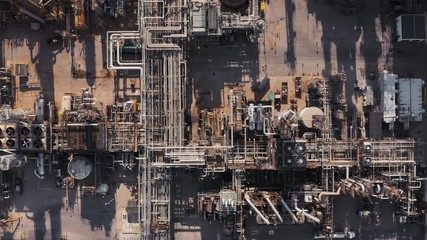 Aerial top view of refinery plant, production line with metal pipes in industry zone