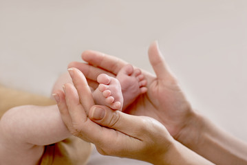 Newborn baby feet. Motherhood concept. Mother day. Copy space. Newborn baby feet. Motherhood concept. Mother day. Copy space. Selective focus