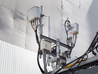 5 G mobile signal tower of cellular communication. Telecommunication tower mounted in the city....